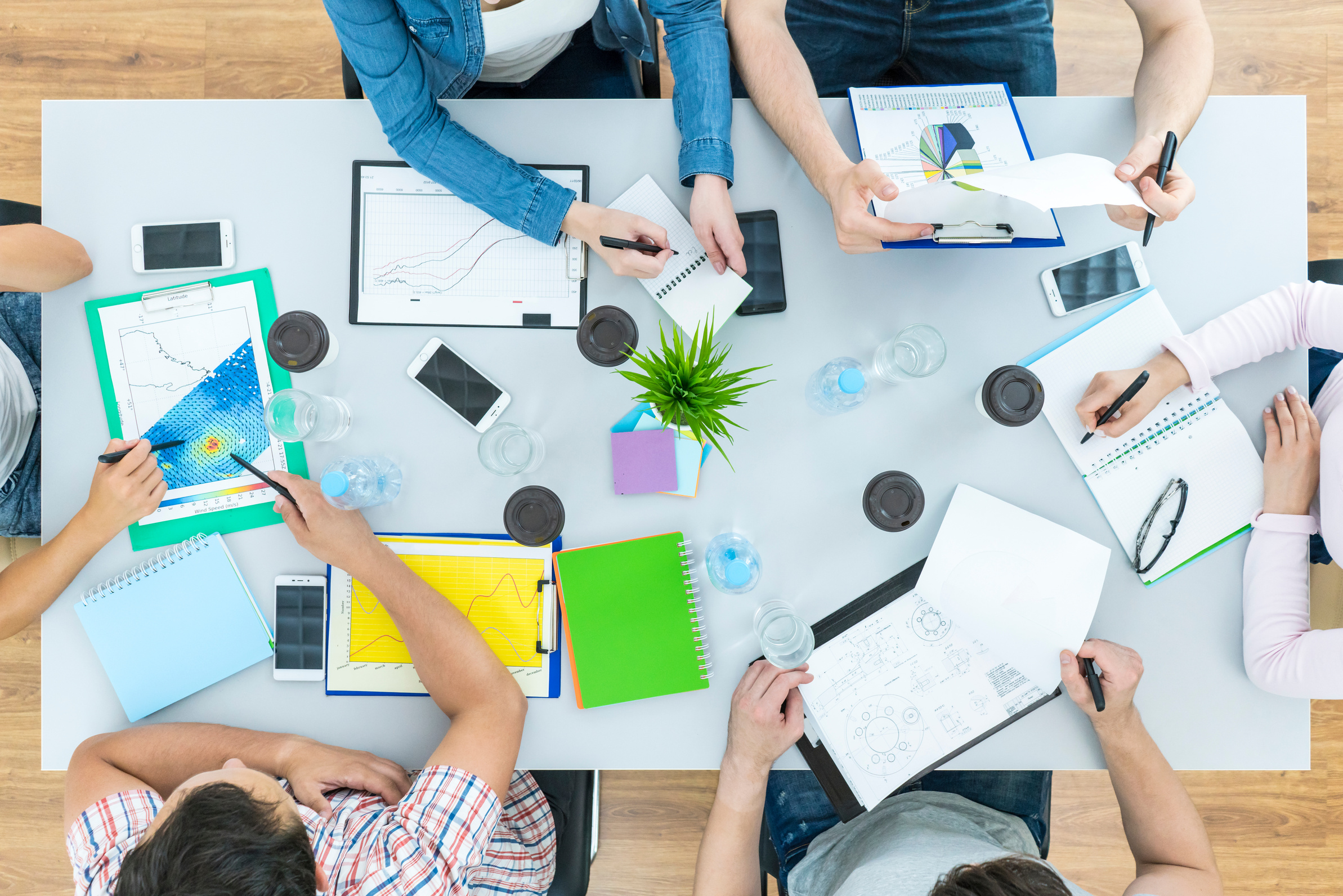 The Six People Work at the Table. View from above